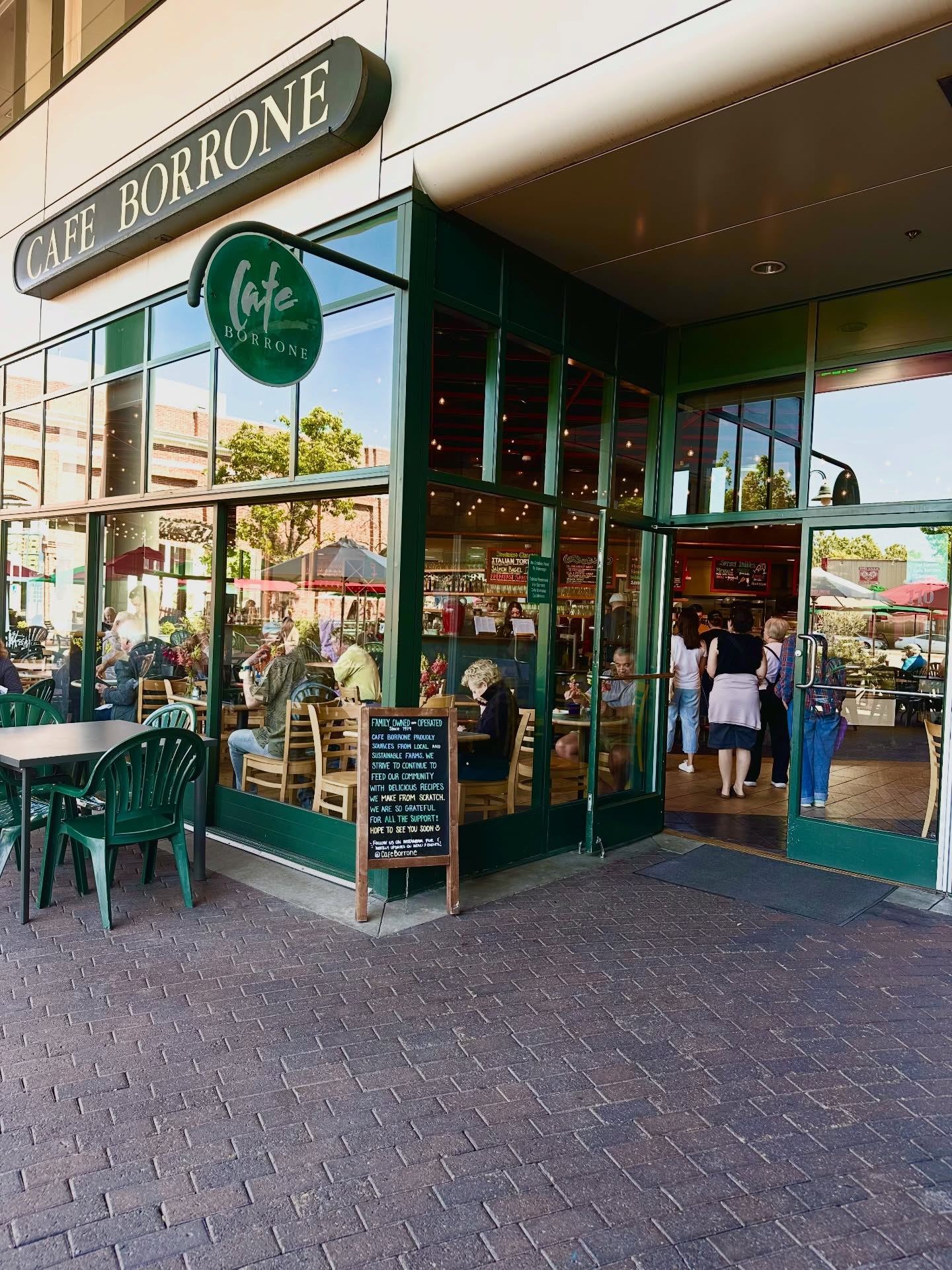 Cafe Borrone entrance with green awning and storefront sign