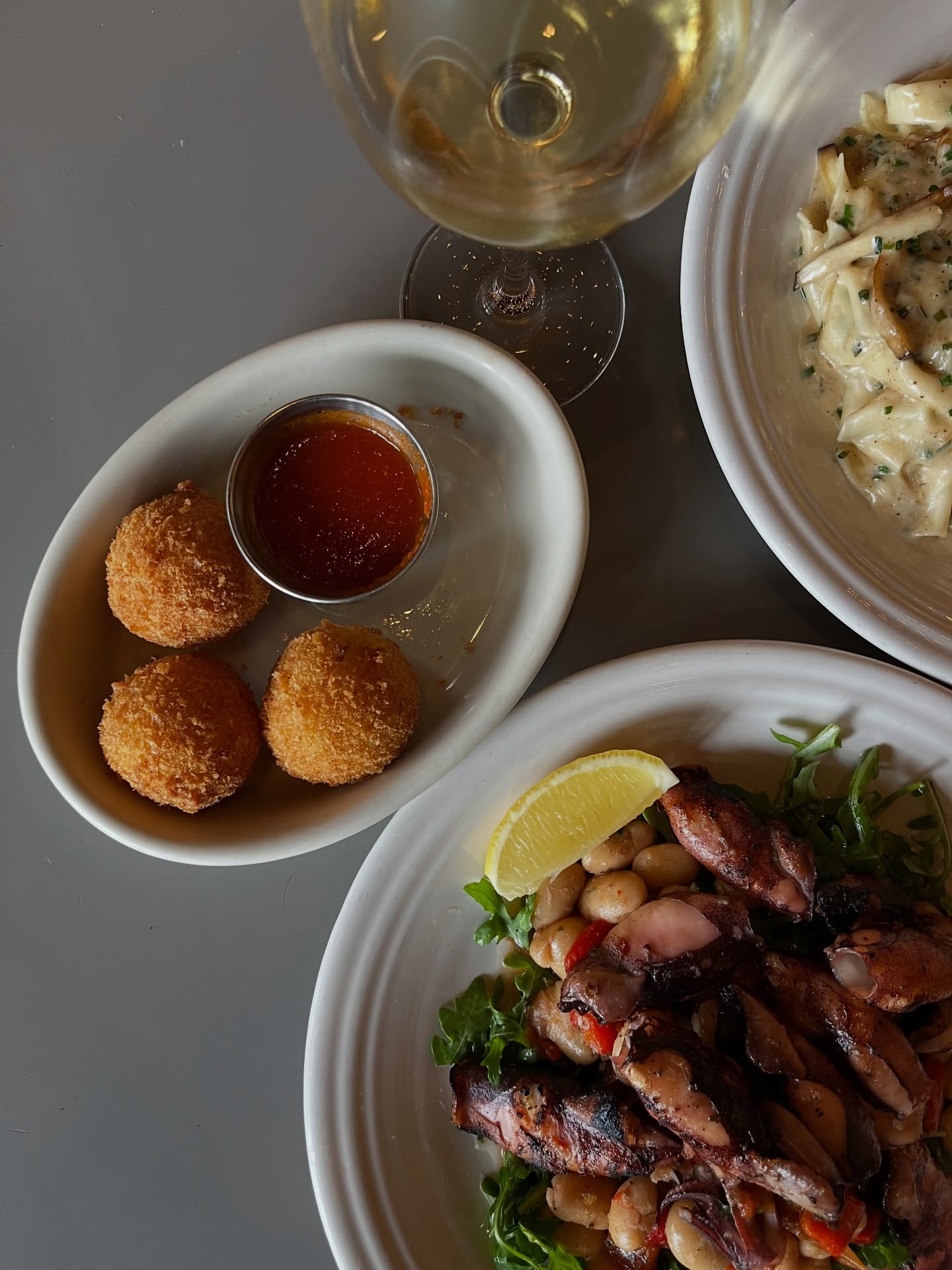 Fried arancini, mushroom pasta and a grilled octopus salad